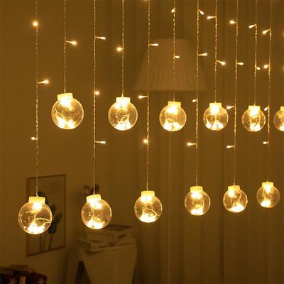 Twinkling LED Curtain Lights with Wishing Ball, Star, and Bell Accents for Christmas and Birthday Decor