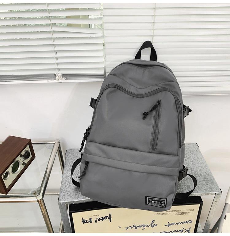 New Korean version of men's and women's large-capacity backpack, junior high school student schoolbag, casual couple college student backpack