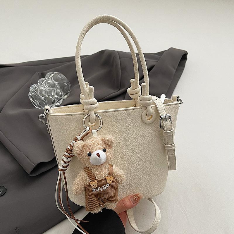 Wholesale hot sale high quality casual lychee pattern solid color portable bucket bag versatile simple wind commuter messenger bag women