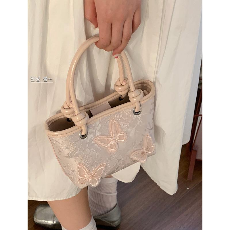 Niszowa torebka pod ramię damska nowa moda niszowa przenośna mała torba tote na ramię listonoszka