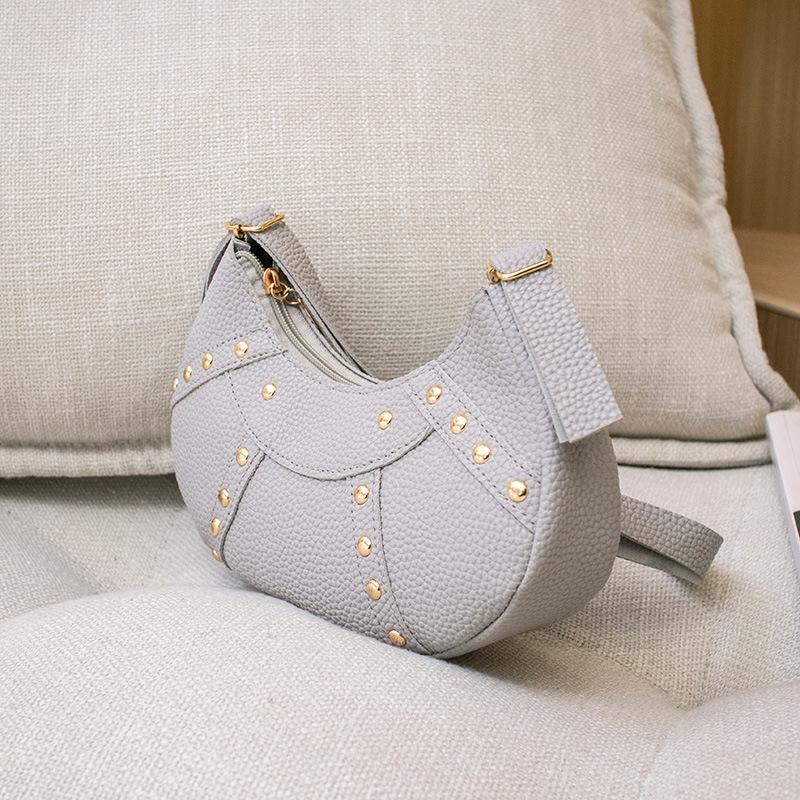 Ladies bag personalized crescent bag rivet splicing underarm portable women's bag fashionable lychee pattern shoulder mobile phone bag