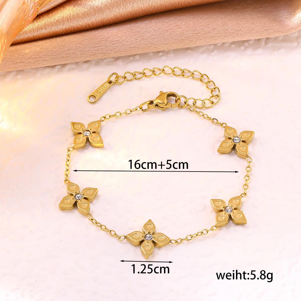 Elegant Four-Leaf Clover Titanium Bracelet with Micro-Paved Diamonds - Light Luxury Women's Floral Jewelry