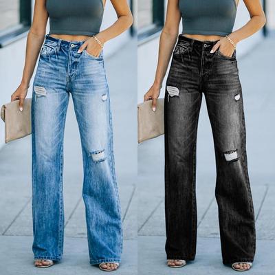 Damenmode, verwaschene, schmale Jeans mit weitem Bein und Loch-Akzenten