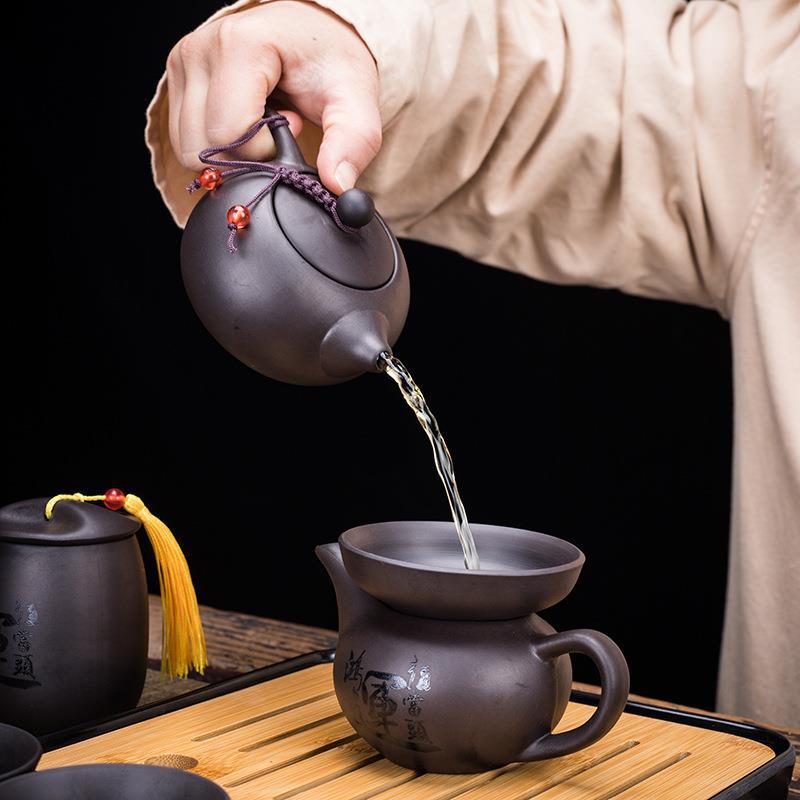 Creative Zisha Travel Kung Fu Tea Set: Portable Storage with One Pot and Four Cups - Ideal for Company Events and Gifts, Customizable with Logo.
