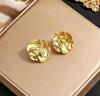 Stainless steel high-end gold earrings, niche design light luxury metal studs, temperament earrings