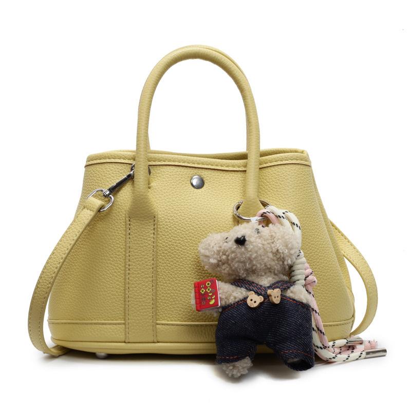 2025 New Niche Simple Leisure Commuter Portable Bucket Bag Versatile Solid Color Child and Mother Bag Messenger Bag Bag