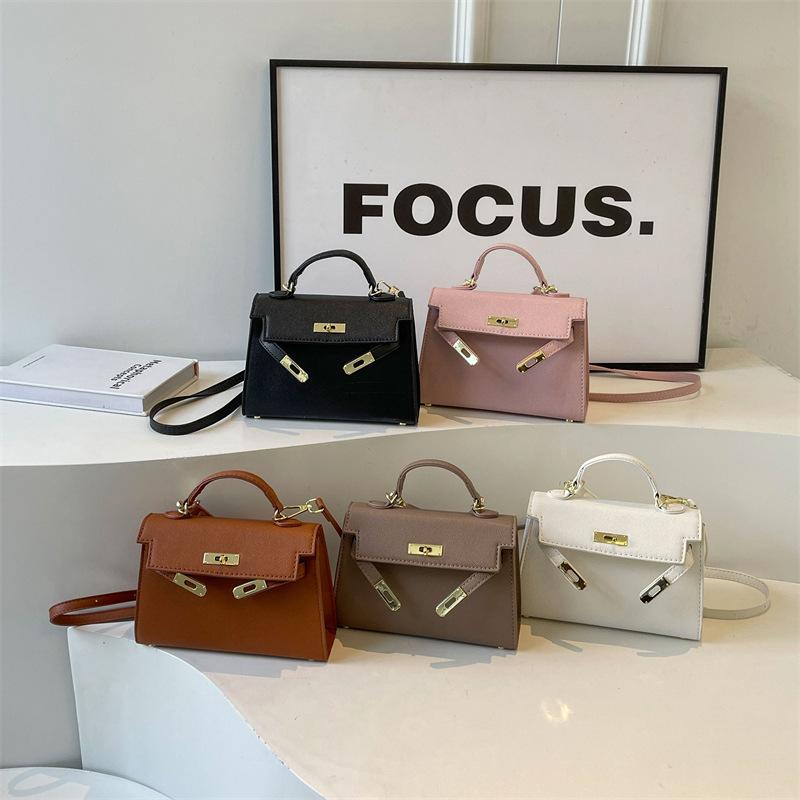 New fashionable solid color cross pattern portable shoulder oblique span trendy women's bag