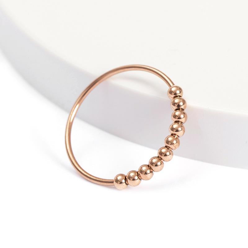 Neuer drehbarer Stressabbau-Angstring mit Perlen