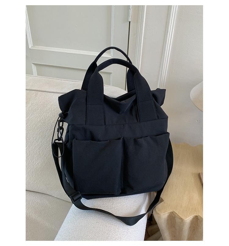 

2025 new casual canvas bag women s large-capacity simple and lightweight tote bag niche commuter shoulder messenger bag чёрный