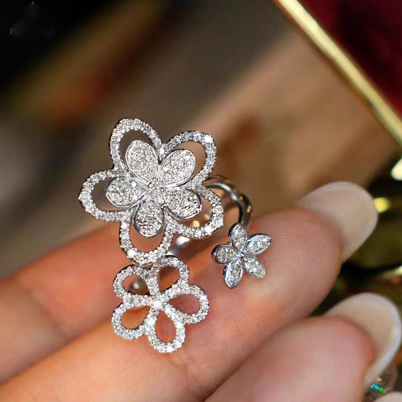 

2026 New European and American Floral Sparkling Open Zircon Ring, Women s Three Inlaid Zircon Lily Zircon Zircon Accessories resizable