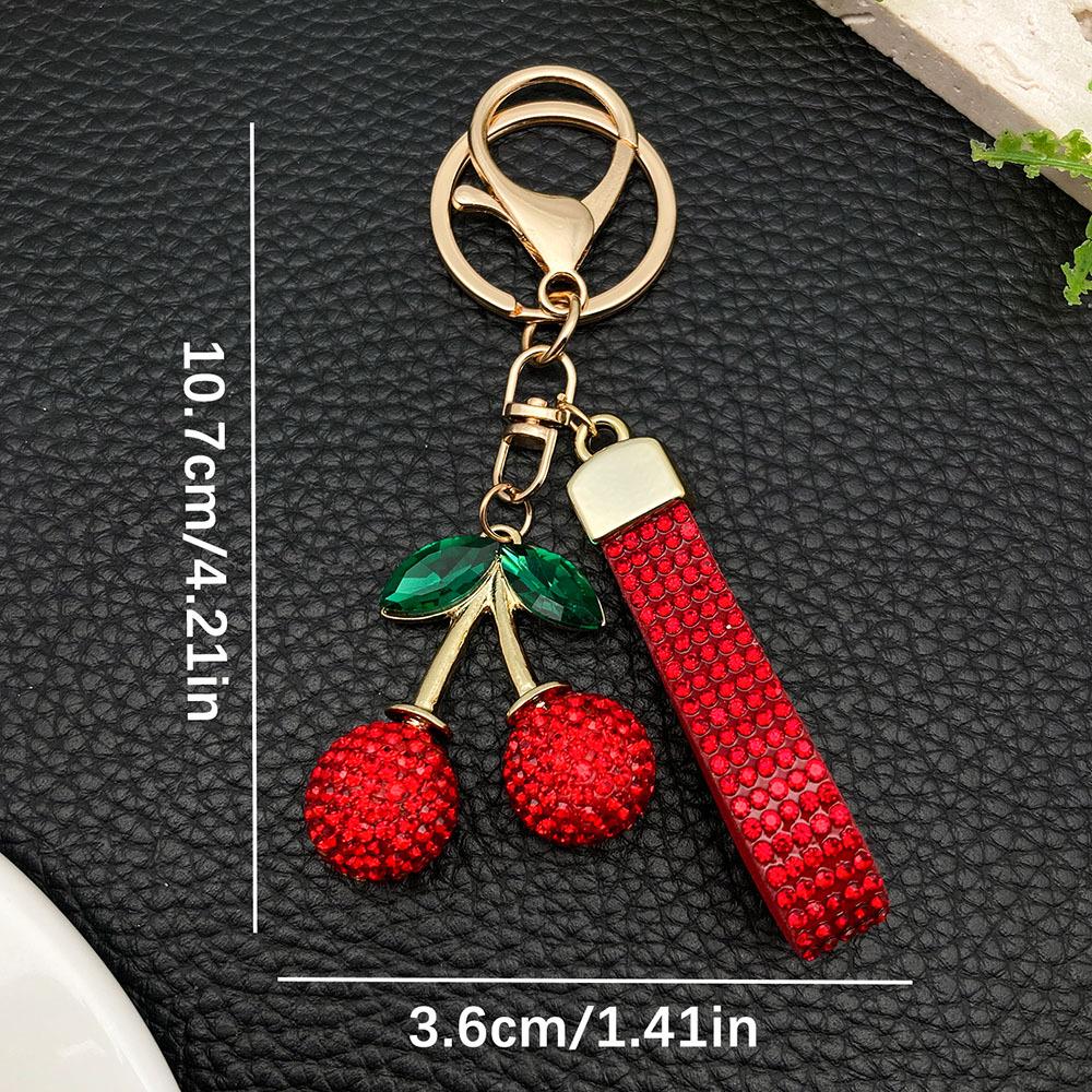 Большой брелок-вишня из смолы со стразами и золотым кольцом