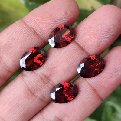 Volná várka zirkonů, Přírodní zirkon oválného brusu velikosti 14x10 mm, Léčivá várka zirkonů červené barvy.