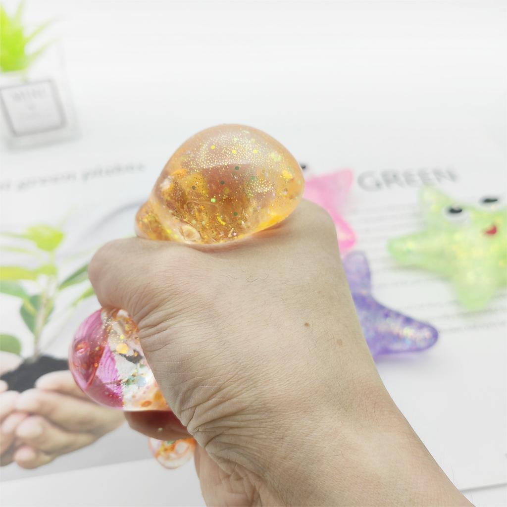 Antistress morbido TPR a lento rimbalzo con paillettes in maltosio, giocattolo antistress elastico da spremere con stella marina dagli occhi colorati, decompressione