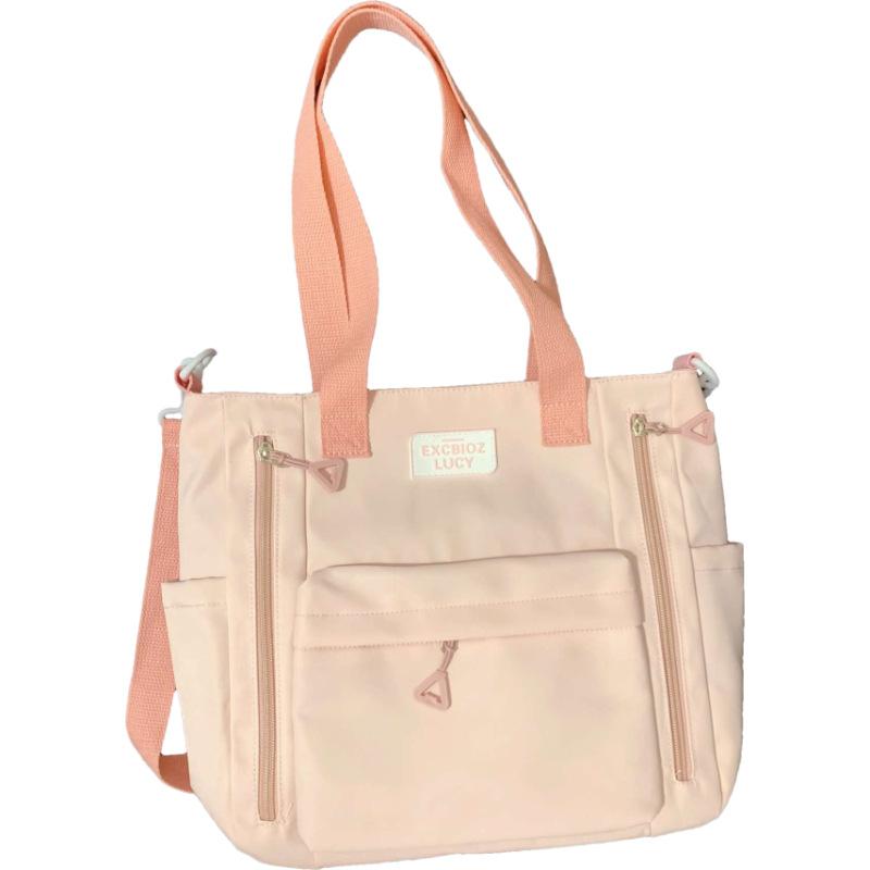 

Solid color simple large-capacity tote bag Korean version fashionable niche portable shoulder bag versatile student make-up messenger bag single package рожевий