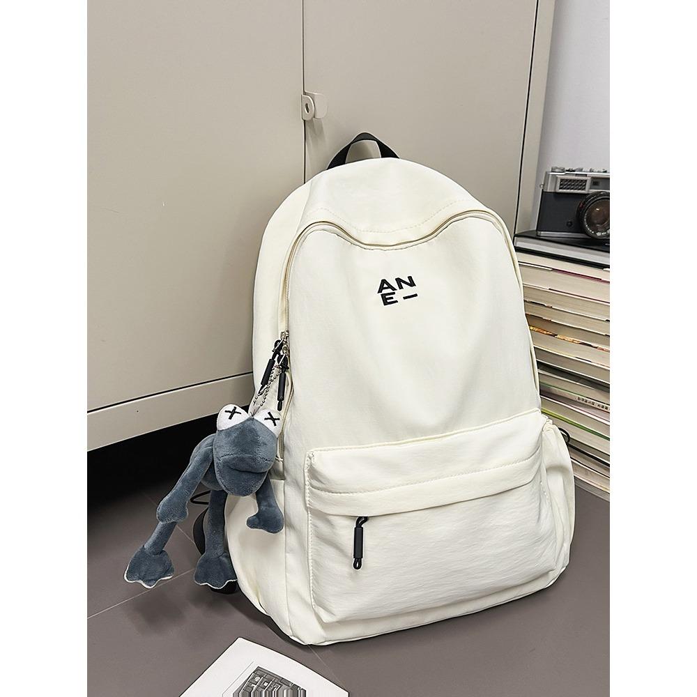 Korean version couple simple large-capacity backpack leisure commuter college student schoolbag niche light travel backpack women