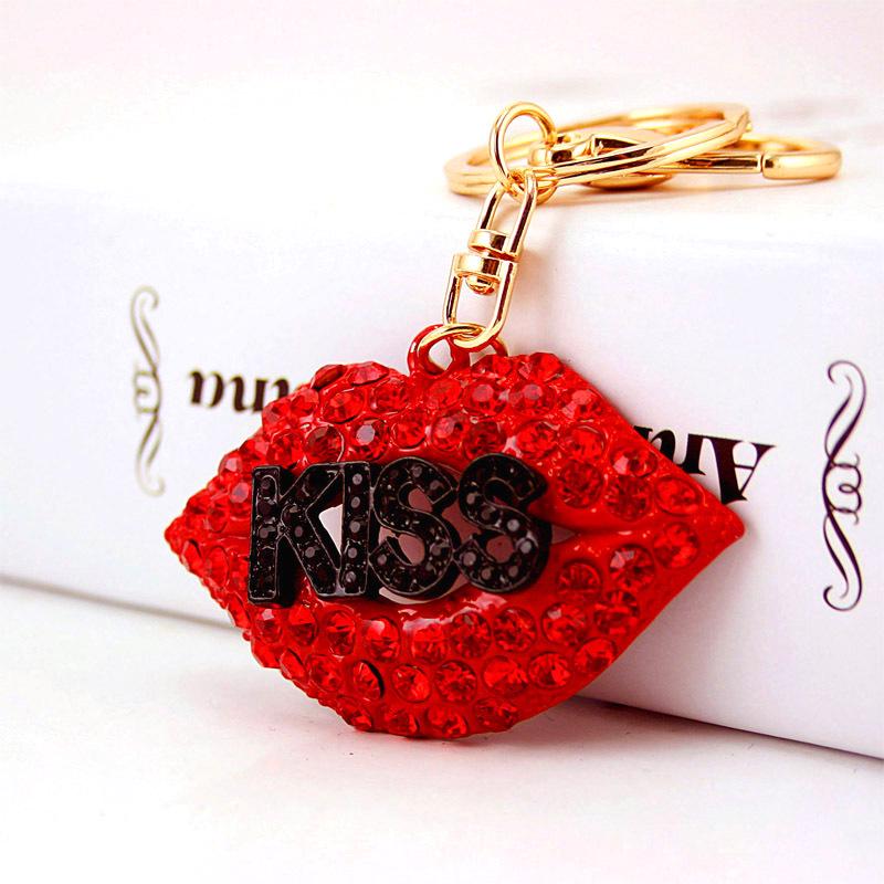 Elegant Diamond-Studded Four-Leaf Clover Keychain: Perfume Bottle Bag Charm for Women