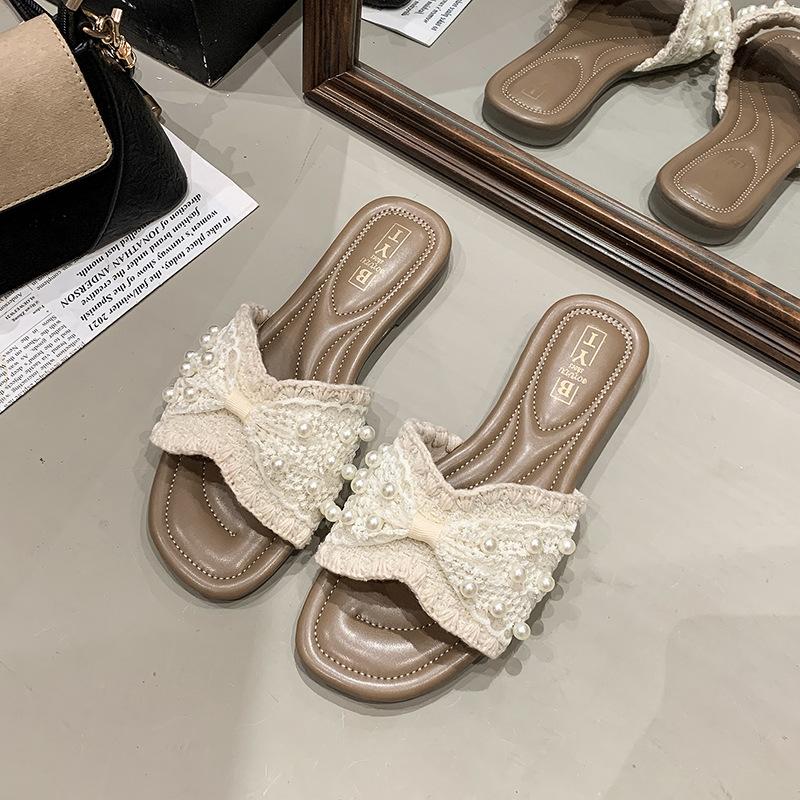

Жемчужные шлепанцы женские летние 2025 новая мода плоская подошва один ремешок пляжные прохладные шлепанцы 40