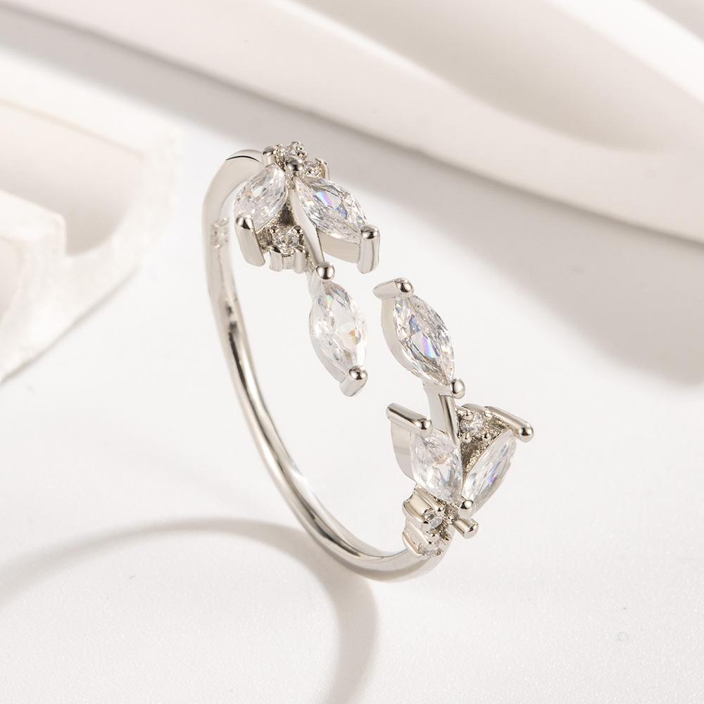 

Легкий роскошный дизайн, кольцо из листового циркония, женский внутренний прилив, отверстие в форме листа, простое и регулируемое для холодного ветра