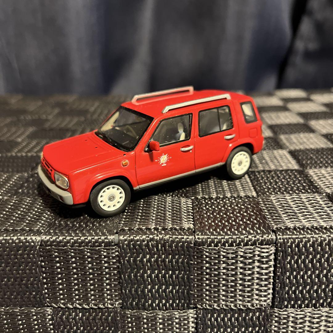 

[Б/У] Миниатюрная модель автомобиля Nissan Rasheen вишневого цвета в масштабе 1/43 от Norev