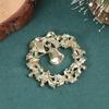 Cross-Border Reindeer Christmas Brooch with Green Wreath & Bell Drip Oil Design