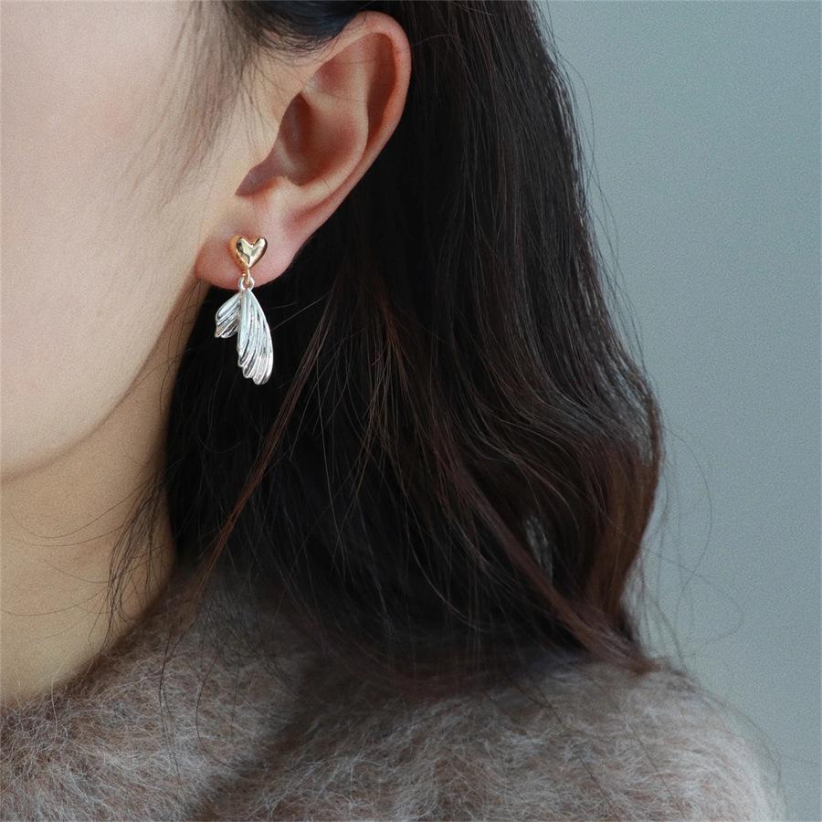 Gold and silver contrasting color love fish tail stud earrings s925 silver niche light luxury earrings temperament versatile earrings