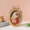 Handcrafted Antique Gold Carving Oval Bowknot Picture Frame With Hanging Hook And Stand For Wall Or Desktop Decoration