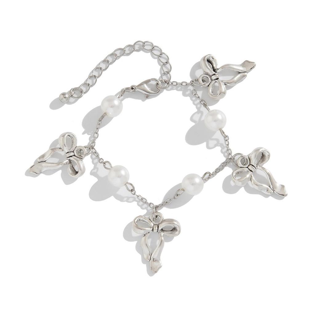 Bowknot Tassel Bracelet with Faux Pearl Accents Fashionable Bowknot Tassel Bracelet for Girls Showcasing Elegance