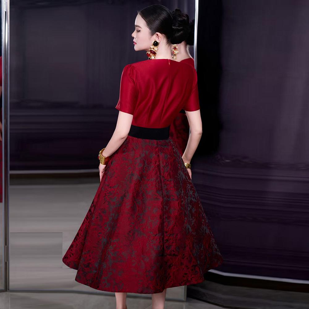 French Spring/Summer 2026 Women's V-Neck Black Bow Tie Jacquard Dress with Waist-Cinching and Wide Hem.