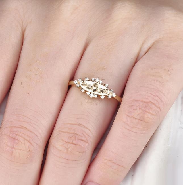 An Elegant Golden Ring with A Symbol of Love, A Sparkling Zircon, An Accessory for Special Occasions and Nights