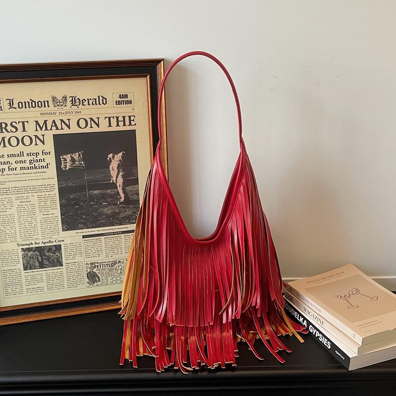 Large-capacity commuter fringed bag women's 2026 spring new retro go out hand carry shoulder armpit bag
