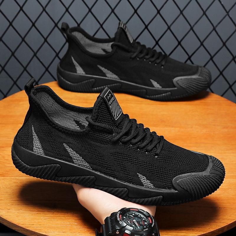 Wiosenne nowe męskie buty elastyczne fly-woven oddychające czarne siateczkowe sportowe buty casualowe lekkie wsuwane buty do biegania