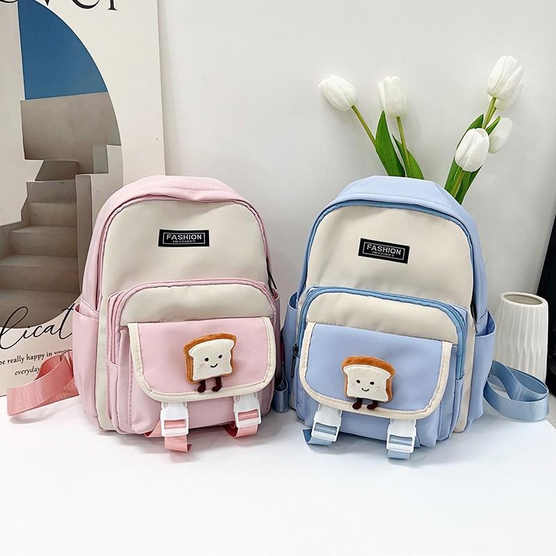 New primary school students backpack women's new large-capacity first and second grade schoolbag simple and fashionable contrasting color backpack