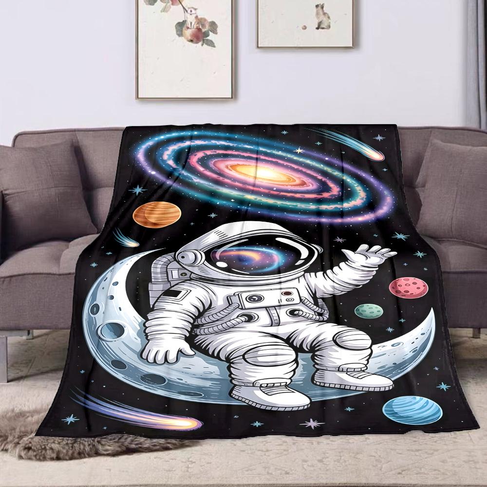 Astronaut Sitting on Moon in Space Patterned flannel blanket perfect for the bedroom living room, sofa, or a little nap