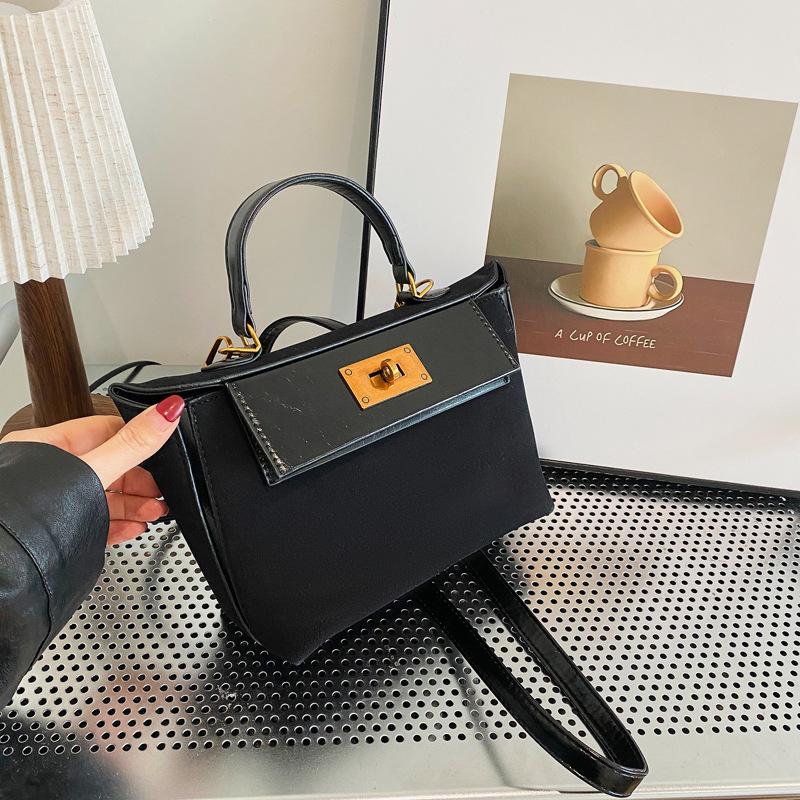 The new high-end sense bag contrasting colors, the messenger women's bag carried by the Kell wing bag.