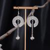 Bohemian Ethnic Miao Silver Tassel Earrings with Butterfly, Peacock, and Flower Design for Women – Long Dangle Jewelry for Travel Photos.