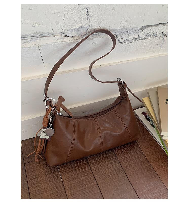 

French niche large-capacity dumpling bag women s 2025 new Korean version of retro texture shoulder bag high-end crossbody bag коричневий