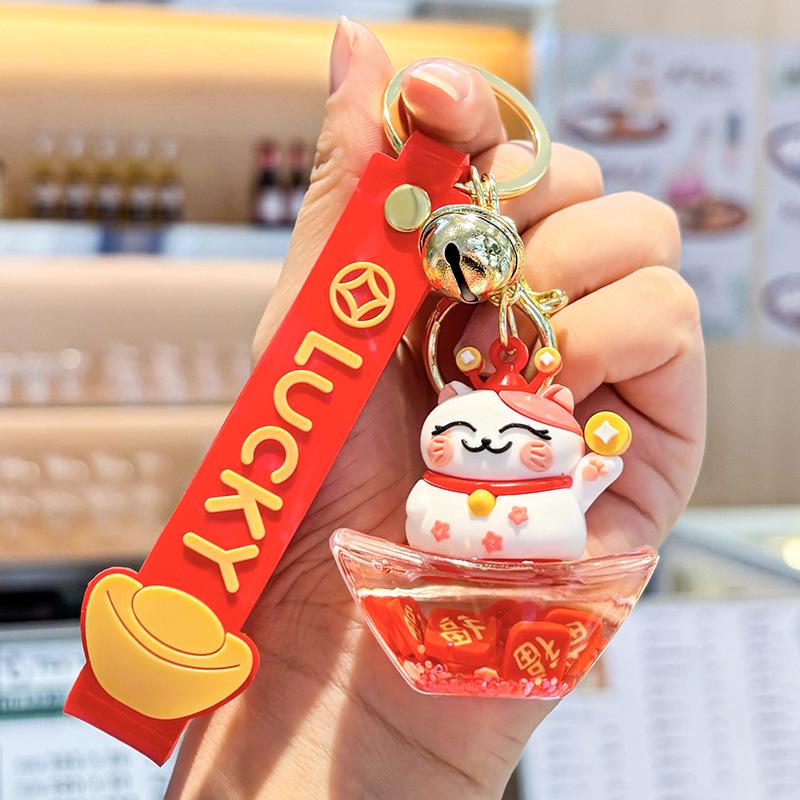 Akrylový přívěsek na klíče s tekutým pískem a obsahem oleje - Perfektní malý dárek na tašku nebo do auta.