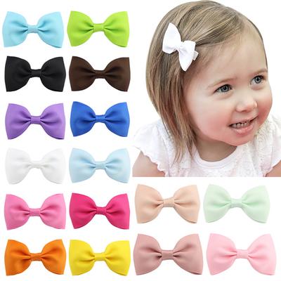 Pair of bow hair clips 2 inch bows snap clips girls toddlers babies school