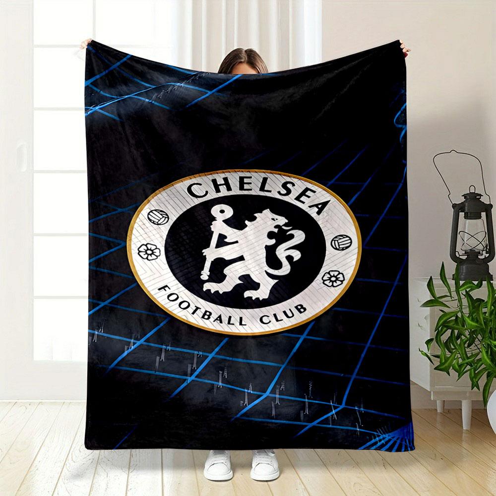 A circular logo with a lion holding a staff, surrounded by a grid pattern. for all seasons blanket lunch break throw gift
