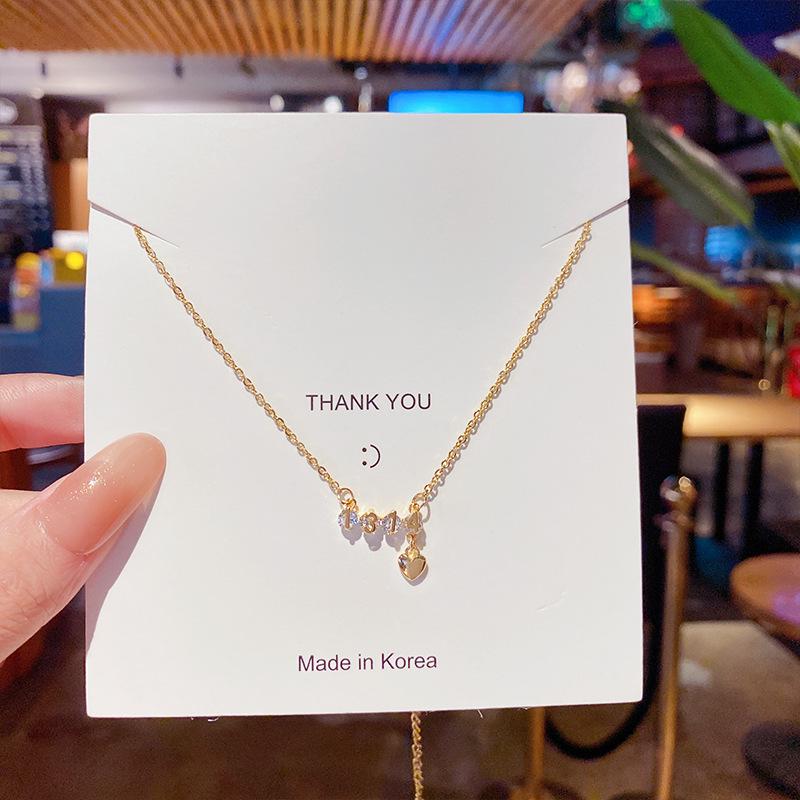 Minimalist Clavicle Necklace: Japanese & Korean Style, Luxurious Real Gold-Plated Titanium Steel Pendant for Women