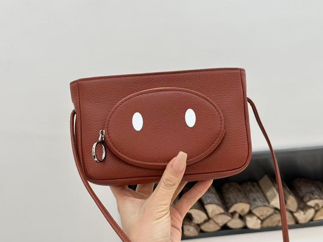 

Cowhide Leather Mini Pig Crossbody Bag - Women s Versatile Coin, Earphone, and Phone Holder 18cm Length, 3cm Width, 11cm Height brick червоний колір