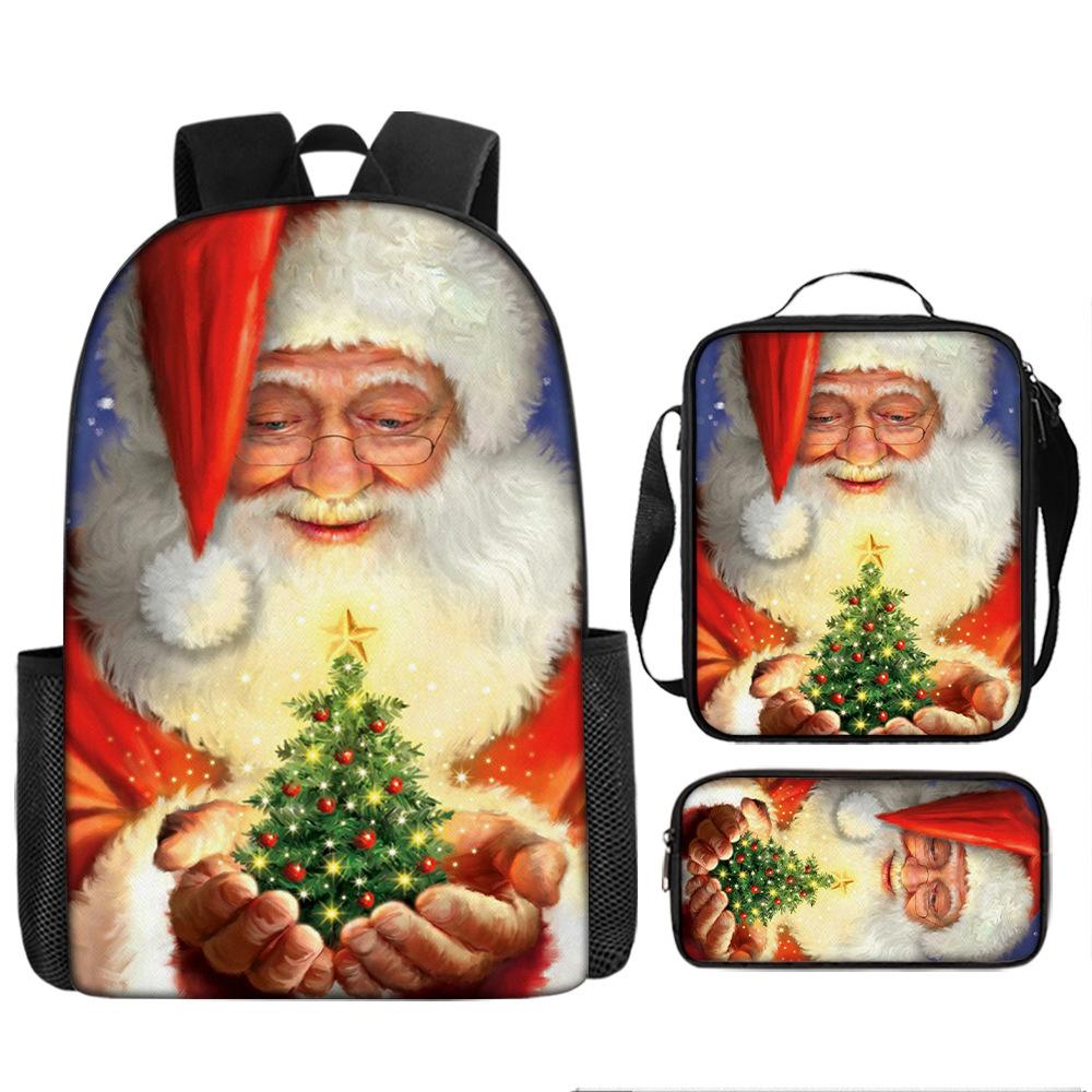 

Рюкзак Санта Клаус с рождественской елкой, школьная сумка для начальной школы, большая вместимость, сумка для досуга, сумка для ланча, пенал, набор из трех предметов 17-inch backpack