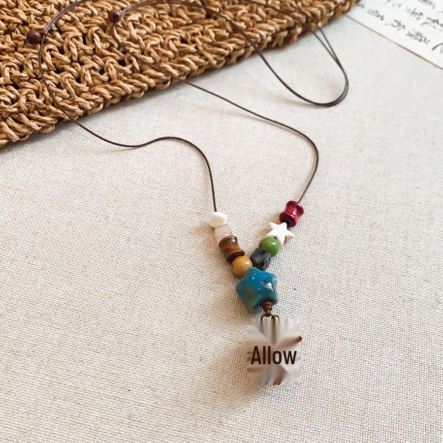 Ethnic Retro Leather Rope Raffia Necklace: Pine Cone & Mushroom Design, High-End Fashion Sweater Chain for Women