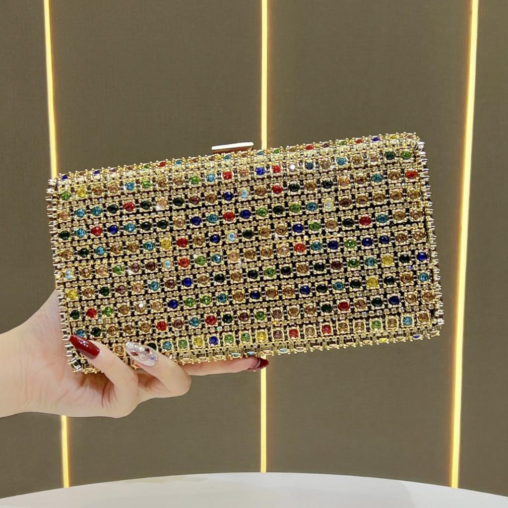Lady Holding A Fashionable Evening Bag. Designer Water Droplet Chain Handbag for Ladies. Shoulder Bag for Ladies. Casually