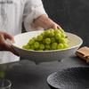 Plateau à fruits à quatre pieds en céramique à motifs de pierre mate, assiette à salade ovale, assiette profonde, assiette à bonbons et noix, vaisselle créative pour la maison