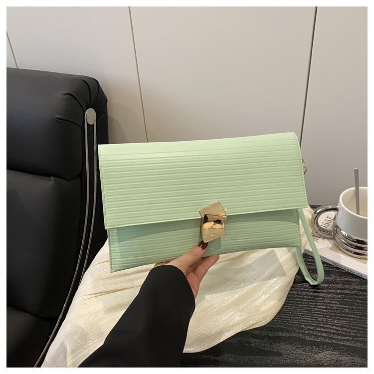 

Популярна та свіжа літня нова мода простий горизонтальний дизайн тренд ручна сумка-конверт жіноча зелений