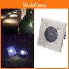Luminaire solaire d'extérieur rond encastré en acier inoxydable, idéal pour décorer une allée de jardin.