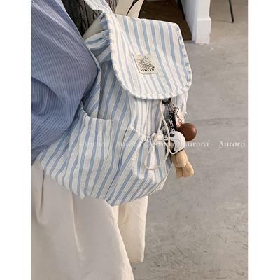 Sac à dos rayé en toile décontracté style collège pour femme 2025 nouveau polyvalent grande capacité simple sac à dos sac d'école étudiant
