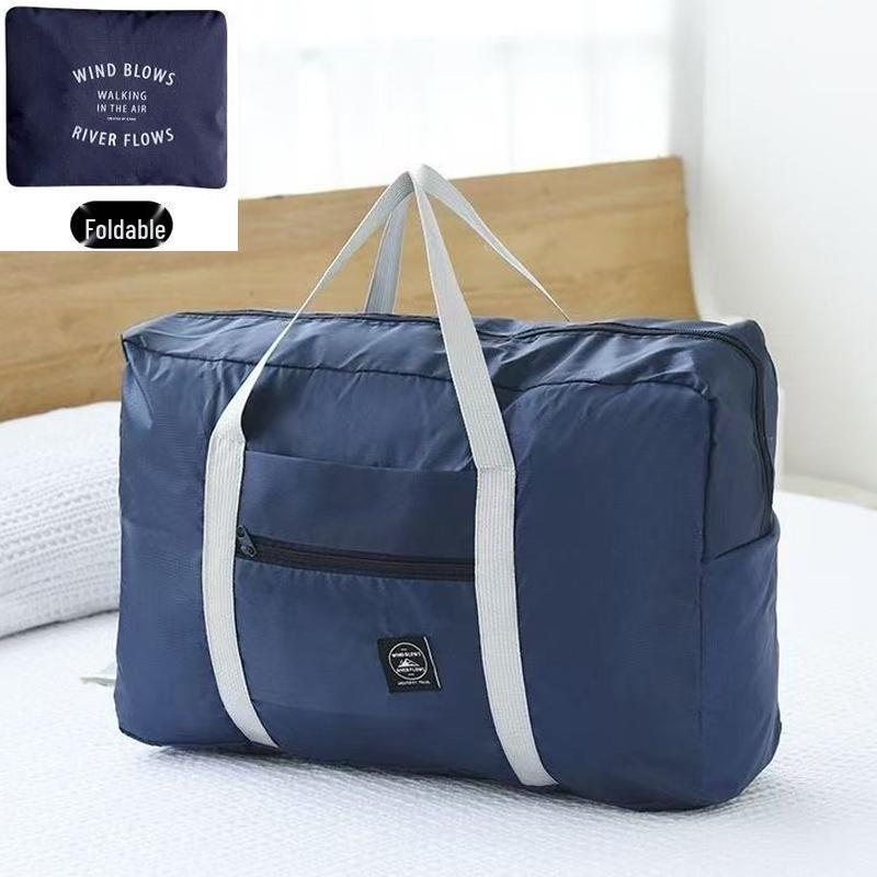Compact travel bag: suitcase-compatible, hand-held, features an external pocket, handle slip-over design, with matching accessory bag.