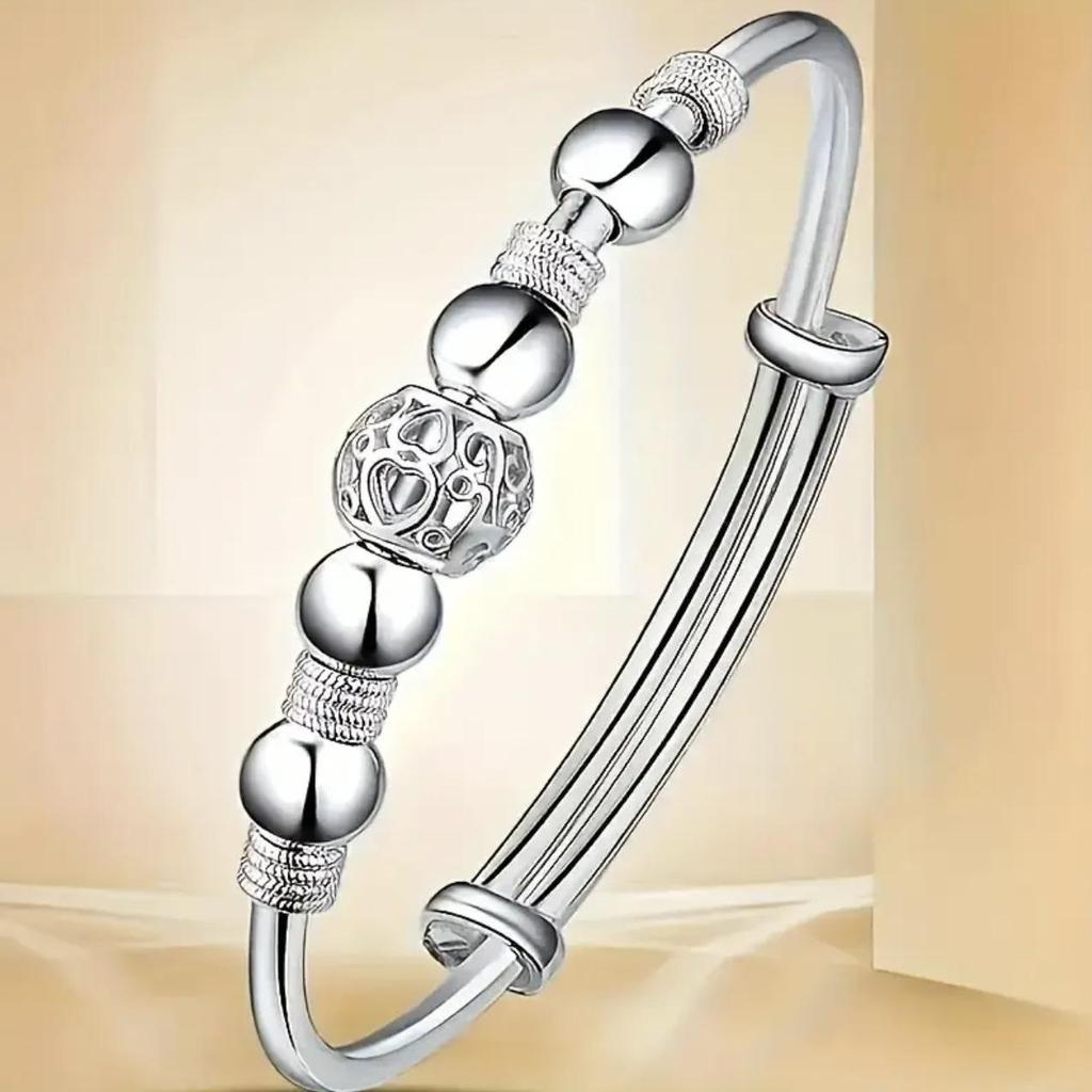 European-Style Silver-Plated Rotating Bead Bracelet for Women: Hollow Exquisite Ball Ornament Jewelry